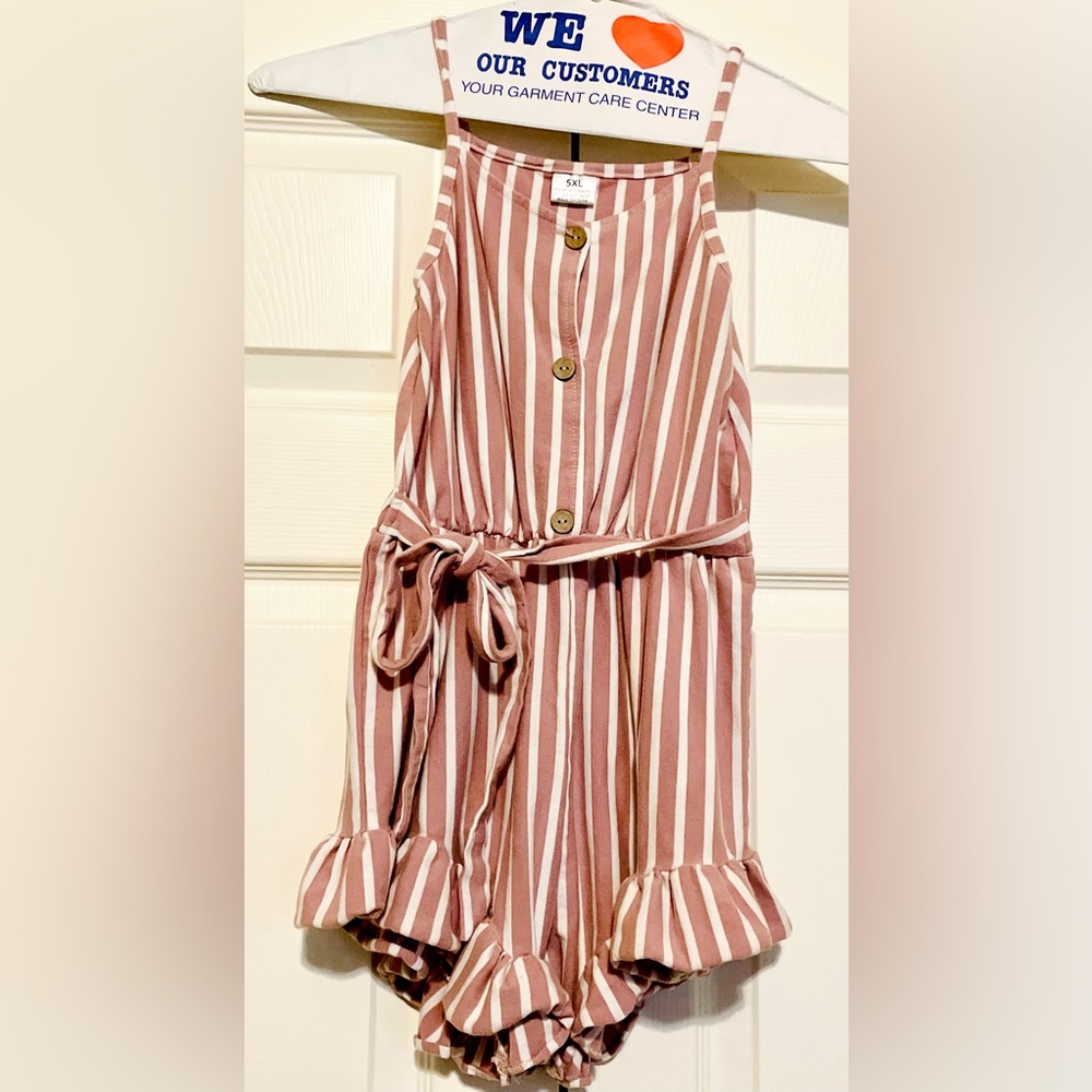 Girls button down romper with a tie, mauve and white stripes.